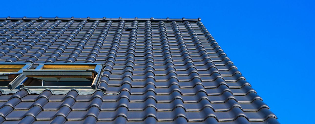 vertical-low-angle-closeup-shot-black-roof-building-scaled-1.jpg